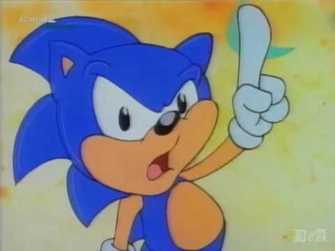 Sonic animado levantando un dedo en señal de advertencia, con una expresión seria y un fondo de colores cálidos.
