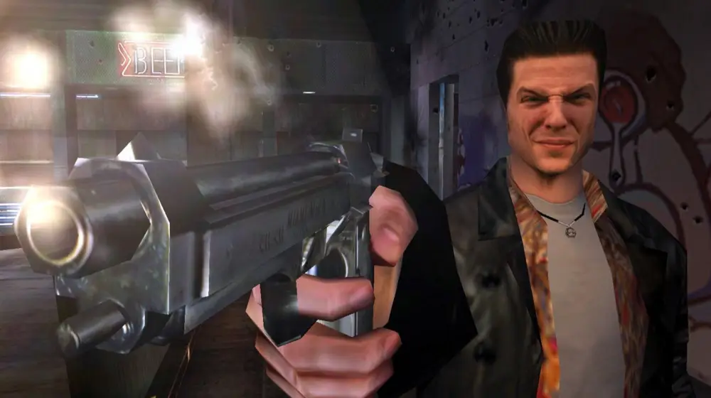 Max Payne apuntando con una pistola mientras dispara, con una expresión tensa y el fondo borroso de un bar en ruinas.