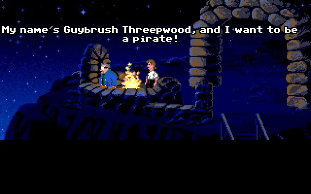 Captura de The Secret of Monkey Island, con Guybrush Threepwood diciendo "My name’s Guybrush Threepwood, and I want to be a pirate!" frente a una fogata nocturna.